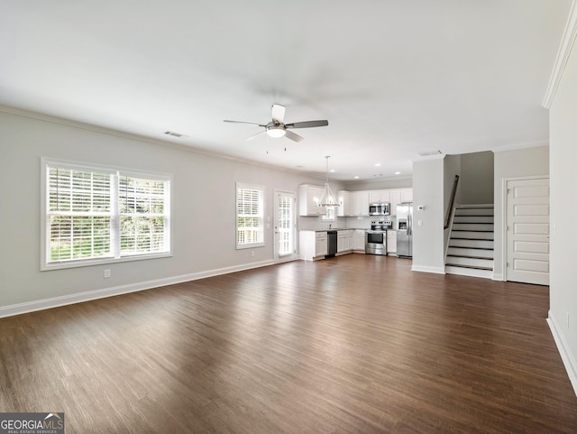 9701 Davis St, Braselton, GA 30517 - unfurnished living room with a ceiling fan, dark wood finished floors, stairs, crown molding, and recessed lighting