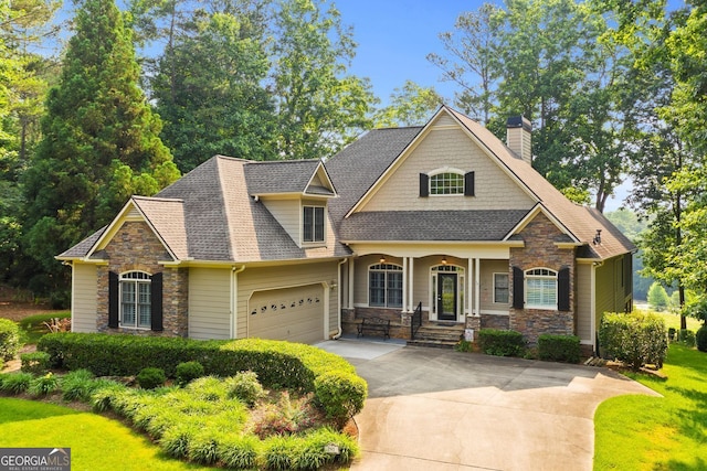 281 Hightower Lake Trl, Ball Ground, GA 30107 - craftsman inspired home with stone siding, concrete driveway, and a garage