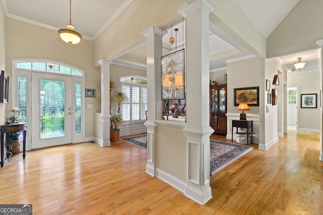 281 Hightower Lake Trl, Ball Ground, GA 30107 - foyer entrance with ornate columns, light wood-style flooring, and crown molding