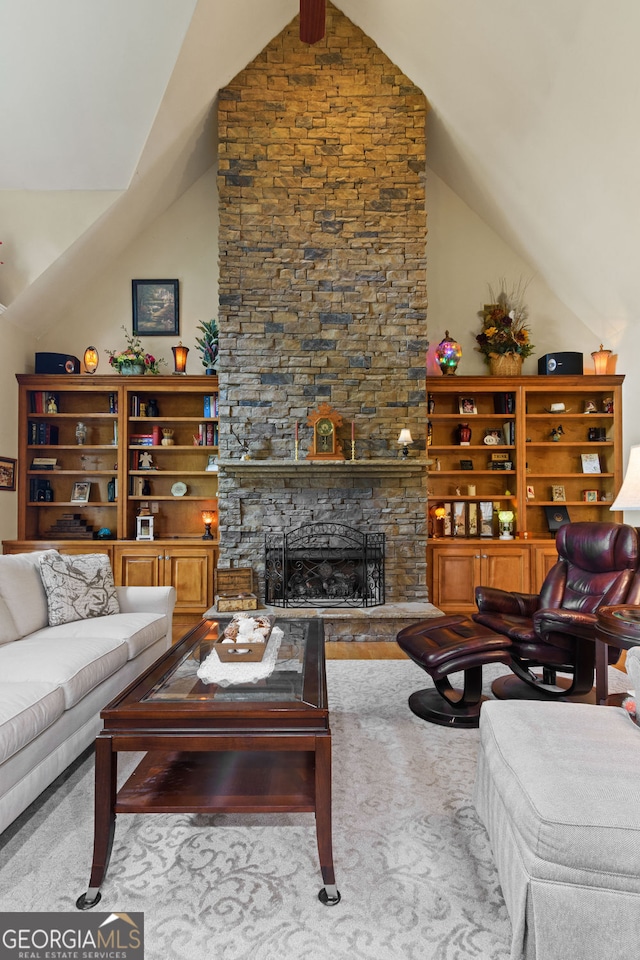 281 Hightower Lake Trl, Ball Ground, GA 30107 - living area featuring lofted ceiling and a stone fireplace