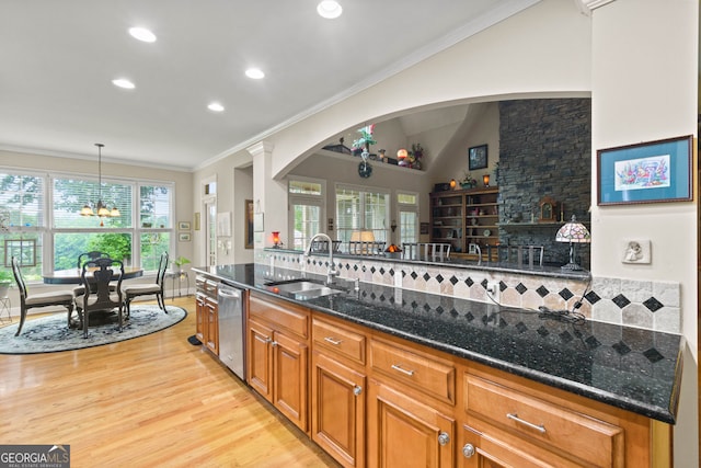 281 Hightower Lake Trl, Ball Ground, GA 30107 - kitchen featuring dishwasher, a chandelier, light wood finished floors, dark stone counters, and brown cabinets