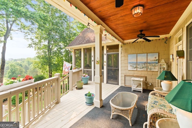 281 Hightower Lake Trl, Ball Ground, GA 30107 - wooden deck featuring a ceiling fan and a sunroom
