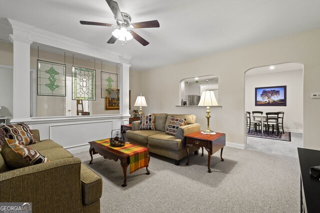 281 Hightower Lake Trl, Ball Ground, GA 30107 - carpeted living area featuring a ceiling fan, arched walkways, and ornate columns