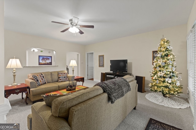 281 Hightower Lake Trl, Ball Ground, GA 30107 - living room with light colored carpet, ceiling fan, and arched walkways