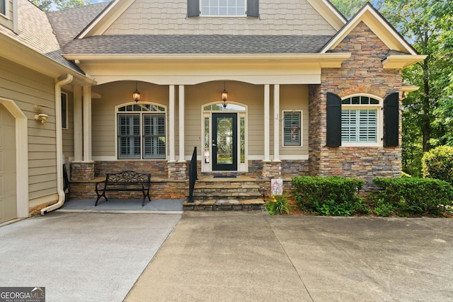 281 Hightower Lake Trl, Ball Ground, GA 30107 - property entrance featuring stone siding and a shingled roof