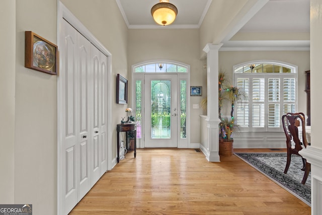 281 Hightower Lake Trl, Ball Ground, GA 30107 - entryway featuring light wood-style floors, ornate columns, and crown molding