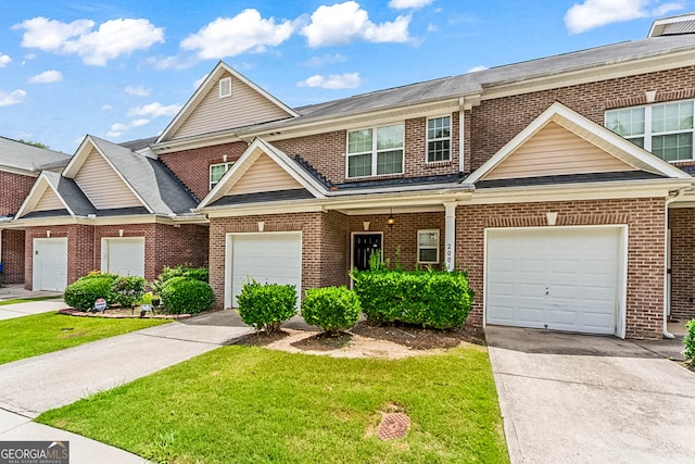 2555 Flat Shoals Rd Apt 2006, South Fulton, GA 30349 - view of front of home with a front yard, brick siding, and concrete driveway