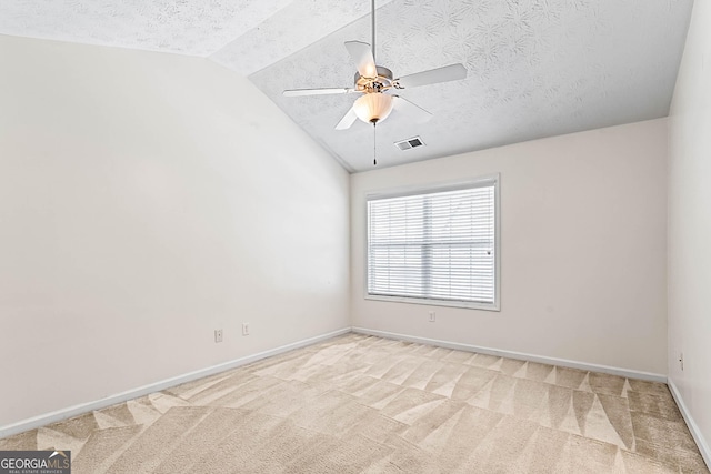 2555 Flat Shoals Rd Apt 2006, South Fulton, GA 30349 - unfurnished room with lofted ceiling, ceiling fan, a textured ceiling, and light colored carpet