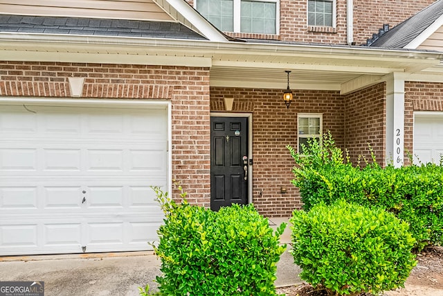 2555 Flat Shoals Rd Apt 2006, South Fulton, GA 30349 - doorway to property with brick siding and a porch