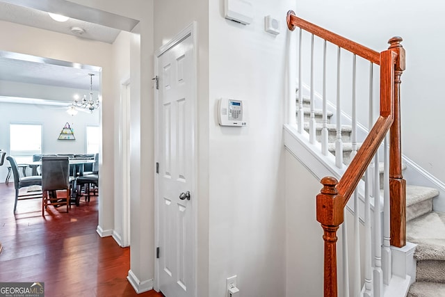 2555 Flat Shoals Rd Apt 2006, South Fulton, GA 30349 - stairs with a chandelier and wood finished floors
