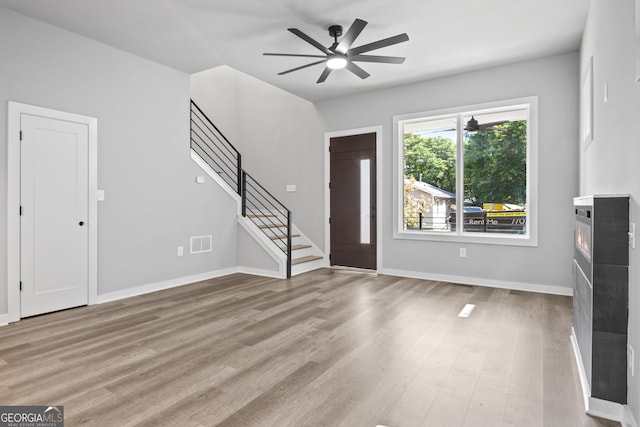 569 Middle St SW, Atlanta, GA 30310 - entryway featuring stairway, a ceiling fan, and light wood-style flooring
