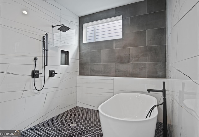 569 Middle St SW, Atlanta, GA 30310 - bathroom featuring tile walls, a freestanding bath, tiled shower, and tile patterned flooring