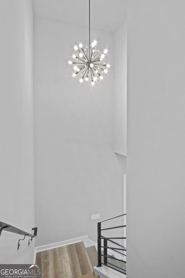 569 Middle St SW, Atlanta, GA 30310 - stairway featuring a chandelier and wood finished floors