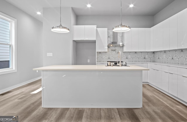 569 Middle St SW, Atlanta, GA 30310 - kitchen featuring wall chimney range hood, modern cabinets, white cabinetry, light wood-style floors, and recessed lighting
