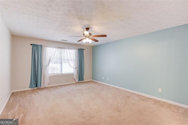 738 Baskins, Winder, GA 30680 - unfurnished room with ceiling fan, light carpet, and a textured ceiling