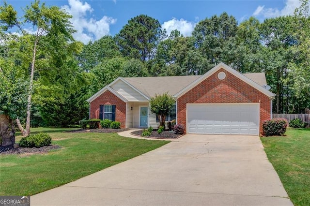 738 Baskins, Winder, GA 30680 - view of front of property with brick siding, an attached garage, and driveway