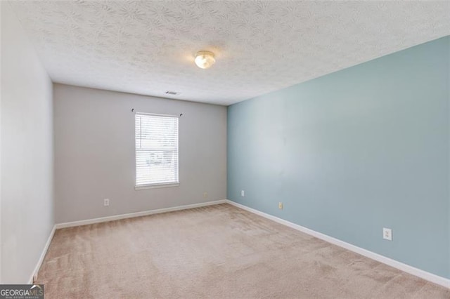 738 Baskins, Winder, GA 30680 - carpeted spare room with a textured ceiling and baseboards