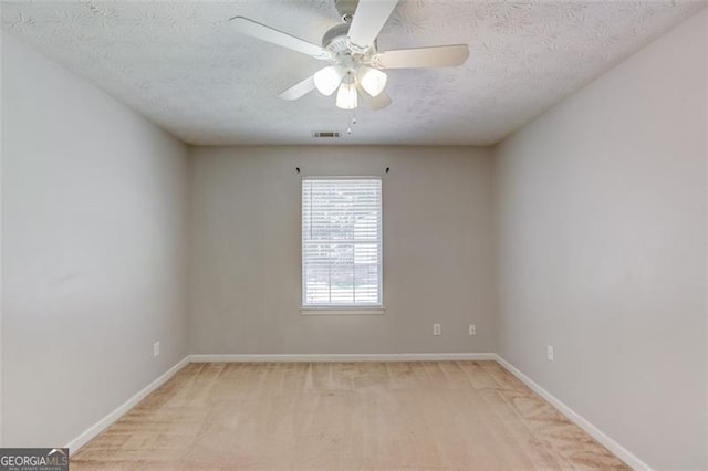 738 Baskins, Winder, GA 30680 - spare room featuring a ceiling fan, light colored carpet, and a textured ceiling