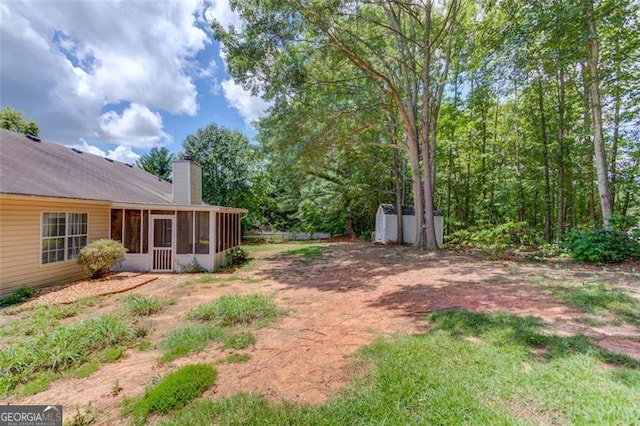 738 Baskins, Winder, GA 30680 - view of yard featuring a sunroom and a shed