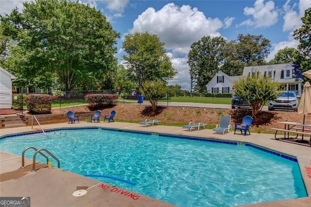 738 Baskins, Winder, GA 30680 - swimming pool featuring a patio