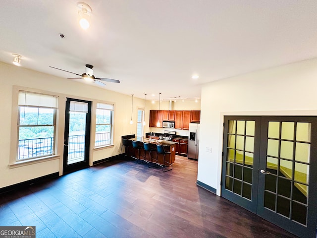 1195 Milton Ter Unit 5204, Atlanta, GA 30315 - kitchen with stainless steel appliances, french doors, dark wood-style floors, ceiling fan, and hanging light fixtures