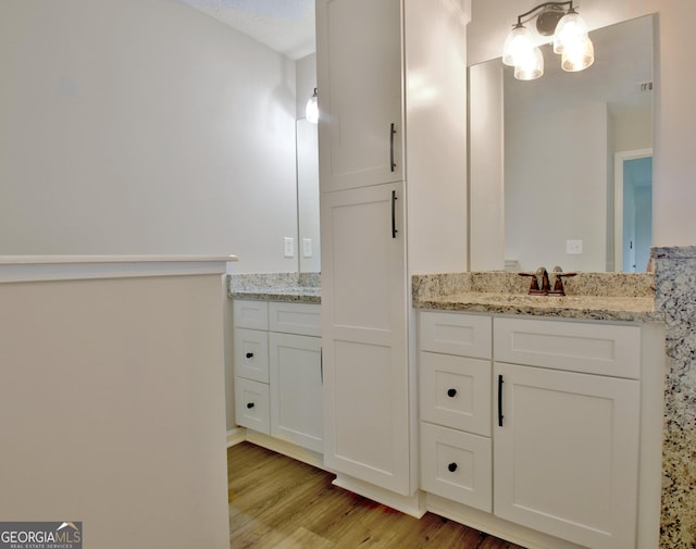110 Chesterfield Ct, Fayetteville, GA 30214 - full bathroom with wood finished floors, a chandelier, and two vanities