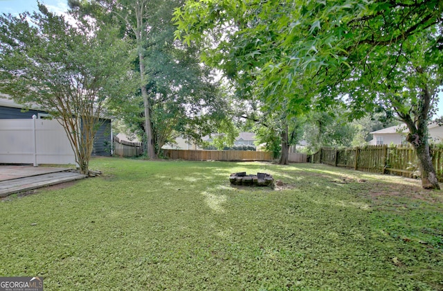 110 Chesterfield Ct, Fayetteville, GA 30214 - fenced backyard with an outdoor fire pit