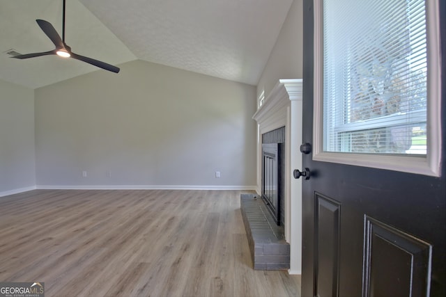 110 Chesterfield Ct, Fayetteville, GA 30214 - entrance foyer featuring lofted ceiling, light wood-style flooring, a ceiling fan, and a fireplace