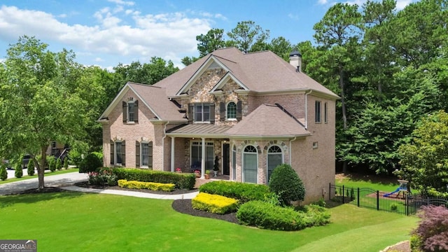 2230 Cambridge Hill Ct, Dacula, GA 30019 - view of front of house with brick siding, a chimney, and a porch