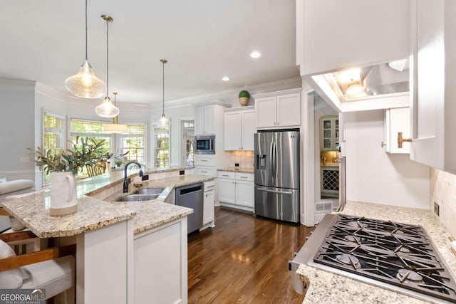 2230 Cambridge Hill Ct, Dacula, GA 30019 - kitchen with stainless steel appliances, crown molding, tasteful backsplash, dark wood-type flooring, and white cabinetry