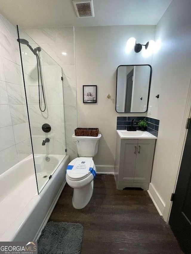 535 Walnut St, Hapeville, GA 30354 - full bath with bathing tub / shower combination, vanity, and wood finished floors