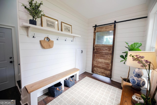 7093 Vaughn Rd, Canton, GA 30115 - mudroom featuring a barn door, wood walls, wood finished floors, and crown molding