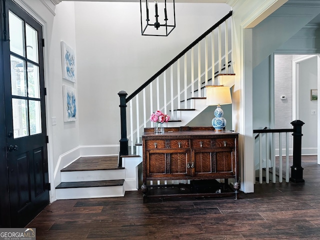 7093 Vaughn Rd, Canton, GA 30115 - foyer entrance featuring wood finished floors, a chandelier, stairway, and a high ceiling