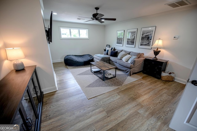 7093 Vaughn Rd, Canton, GA 30115 - living area featuring ornamental molding, wood finished floors, and a ceiling fan