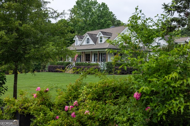 7093 Vaughn Rd, Canton, GA 30115 - view of front of property featuring covered porch and a front lawn