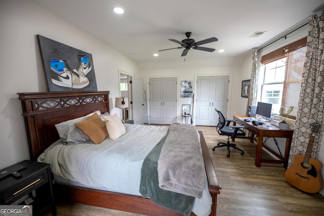 7093 Vaughn Rd, Canton, GA 30115 - bedroom featuring multiple closets, wood finished floors, recessed lighting, an office area, and ceiling fan