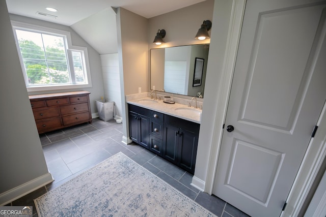 7093 Vaughn Rd, Canton, GA 30115 - full bath featuring double vanity, vaulted ceiling, and tile patterned floors