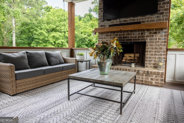 7093 Vaughn Rd, Canton, GA 30115 - view of patio / terrace with an outdoor living space with a fireplace