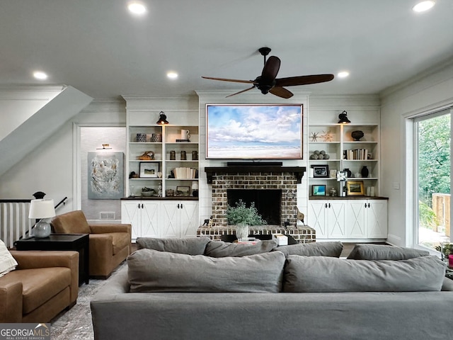 7093 Vaughn Rd, Canton, GA 30115 - living room featuring crown molding, a ceiling fan, a fireplace, recessed lighting, and built in shelves