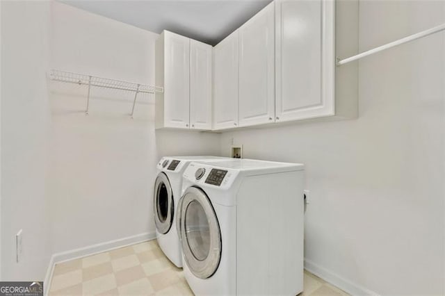 121 Fairway Overlook, Woodstock, GA 30188 - laundry room with cabinet space, washing machine and dryer, and light floors