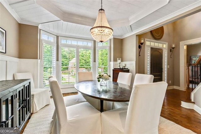 121 Fairway Overlook, Woodstock, GA 30188 - dining room with a chandelier, wood finished floors, ornamental molding, wainscoting, and a decorative wall