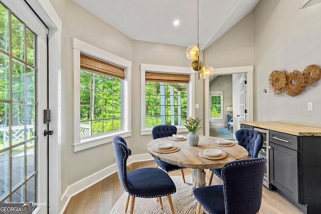 115 Edgewater Way, Peachtree City, GA 30269 - dining room featuring plenty of natural light, vaulted ceiling, and light wood-type flooring