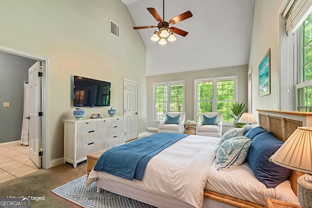 115 Edgewater Way, Peachtree City, GA 30269 - bedroom featuring high vaulted ceiling, multiple windows, ensuite bathroom, light colored carpet, and a ceiling fan