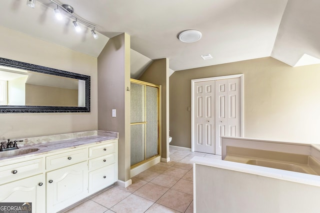 115 Edgewater Way, Peachtree City, GA 30269 - full bathroom featuring a stall shower, vanity, tile patterned floors, a garden tub, and track lighting