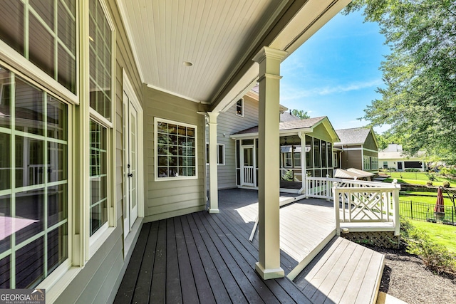 115 Edgewater Way, Peachtree City, GA 30269 - wooden deck featuring a sunroom