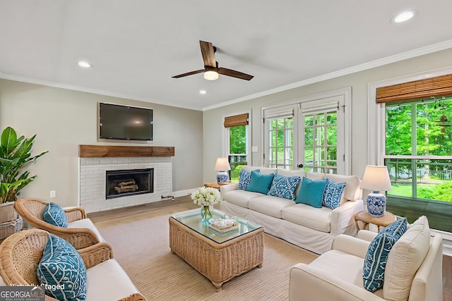 115 Edgewater Way, Peachtree City, GA 30269 - living room featuring ceiling fan, crown molding, a fireplace, recessed lighting, and wood finished floors