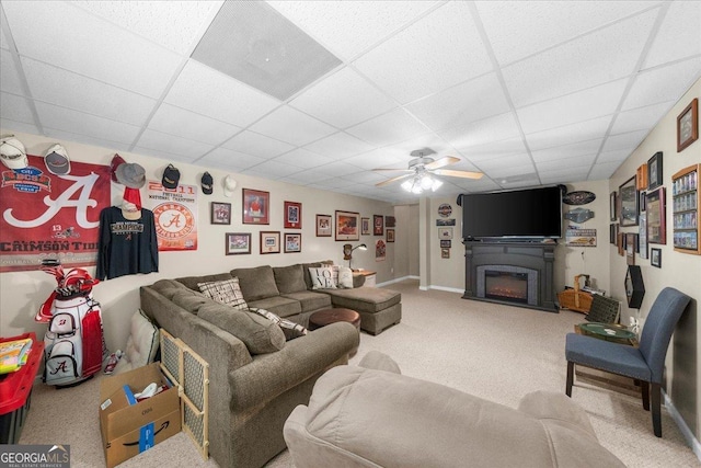 221 Timber Ridge Dr, Clarkesville, GA 30523 - living room with a drop ceiling, ceiling fan, carpet floors, and a glass covered fireplace