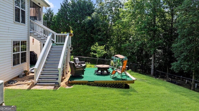 221 Timber Ridge Dr, Clarkesville, GA 30523 - view of playground featuring stairway, a fire pit, and a wooden deck