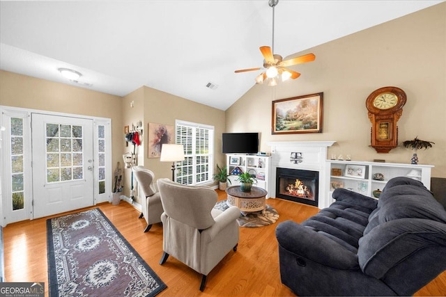 221 Timber Ridge Dr, Clarkesville, GA 30523 - living area featuring healthy amount of natural light, light wood-type flooring, a ceiling fan, and high vaulted ceiling