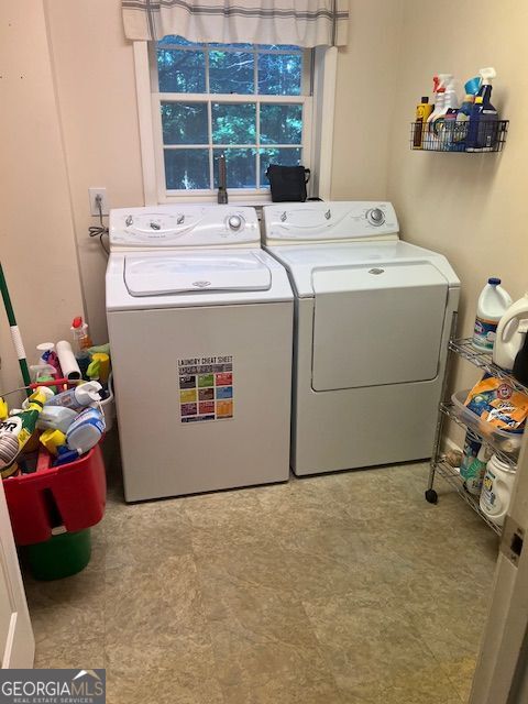974 Bloomfield Dr, Lawrenceville, GA 30044 - laundry area featuring washing machine and clothes dryer and tile patterned floors